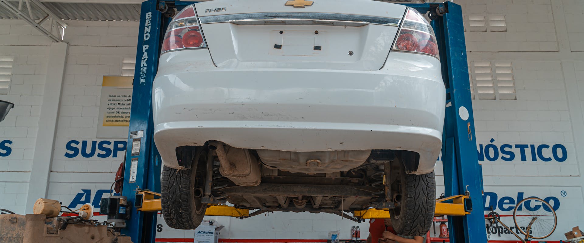 Wheel Alignment Service Louisville KY & Southern Indiana — technician at work in the Pinnacle Motorsports workshop