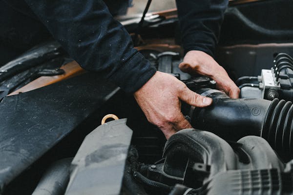 ASE-certified technician performing precision engine work at Pinnacle Motorsports